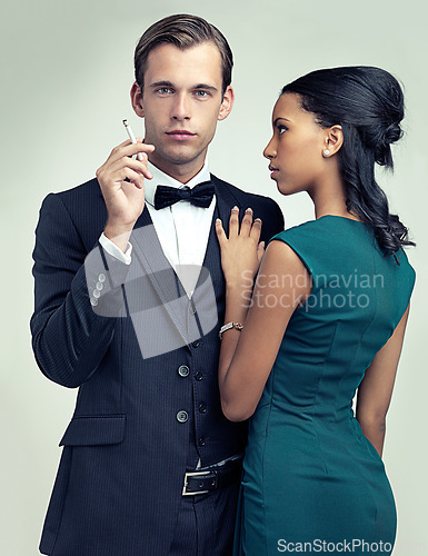Image of Fashion, smoking and portrait for couple, vintage and style for cosplay and trend for classic and classy. Diverse people and gentleman with girlfriend and cigarette for confident, rich and luxury