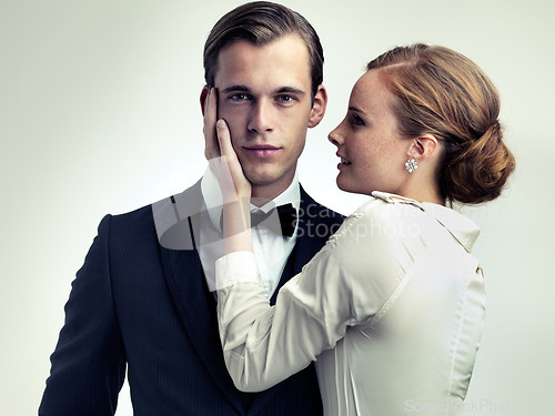 Image of Stylish, couple and portrait in studio for vintage or retro fashion with classic old school look, elegant and glamour. Male person or playboy, woman and together for romance relationship and luxury.