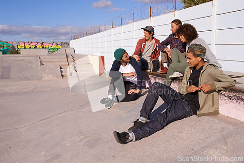 Image of Skate park, diversity and friends with conversation, sunshine and relaxing with discussion and happiness. Multiracial, gen z and team on a break, summer and bonding together with skaters and group