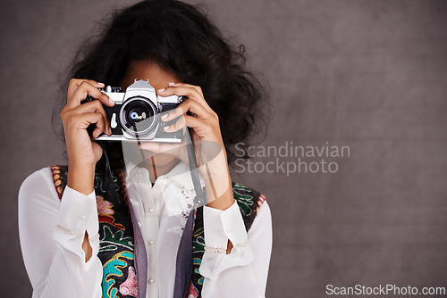 Image of Photography, vintage and woman in studio with camera, creative travel and fashion mockup. Art, professional and Mexican photographer girl with retro hobby, career and boho style on grey background