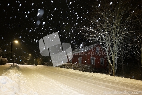 Image of snowy street of the small town of Pernio in Finland at night 