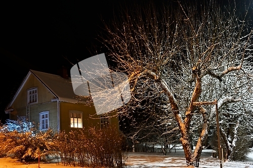 Image of snowy street of the small town of Pernio in Finland at night 