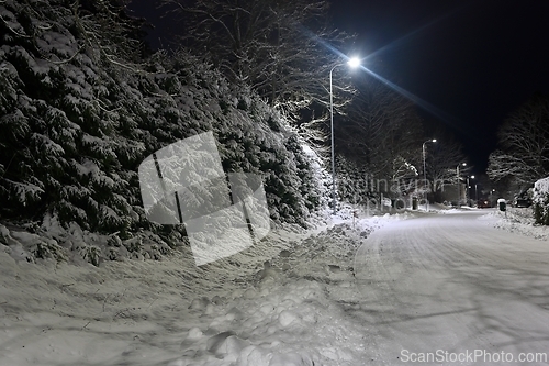 Image of snowy street of the small town of Pernio in Finland at night