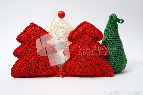 Image of A group of knitted christmas trees