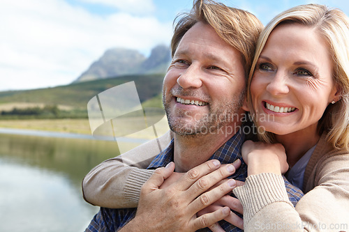 Image of Lake, smile and couple at countryside in summer for weekend vacation, holiday and bonding together. Man, woman and happy with embrace in nature for adventure, travel and tourism outdoors in Europe