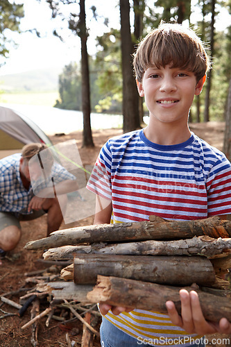 Image of Boy, dad and camping with firewood in portrait for heat, cooking and learning on outdoor adventure. Child, father and wood in forest for holiday, vacation and happy in nature by trees in Colorado