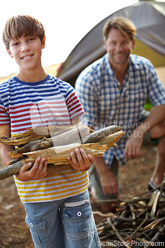 Image of Boy, father and camping with wood in portrait for heat, cooking and learning on outdoor adventure. Child, papa and collecting firewood in forest, vacation and happy in nature by tent in Colorado