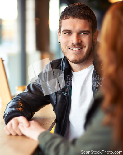 Image of Man, woman and cafe date with love, hand holding for couple and romantic affection. Boyfriend, support together for bonding relationship, female person at table for trust comfort and compassion