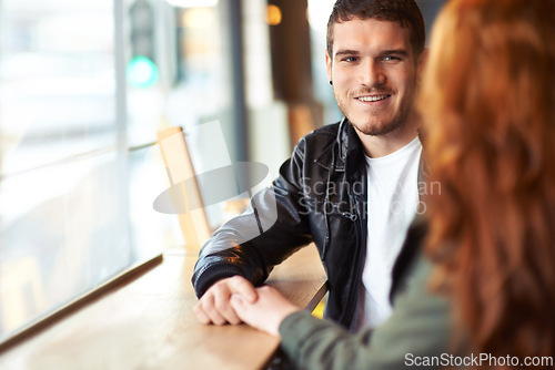 Image of Man, couple and date in coffee shop, hand holding for love and romantic affection. Boyfriend, support together for bonding relationship, female person at table for trust comfort and compassion