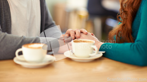 Image of Holding hands, coffee and couple in cafe, support and trust in relationship or marriage together. Diner, adult and partner with compassion, love and care for with respect on date, weekend and break