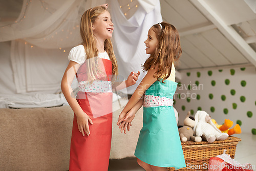 Image of Fashion, paper and children friends with dress for fun, show or playing together at home. Happy, smile and young girl kids in gift wrap outfit for style with bonding in bedroom at modern house.