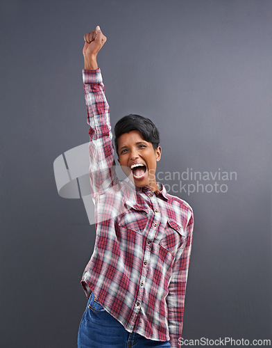 Image of Happy, portrait and Indian person with excited win with gray background from creative agency promotion. Hipster, confidence and employee smile with wow, yes and winner at job with achievement