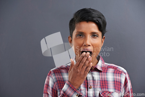 Image of Yawn, tired and portrait for woman with gesture for sleepy, fatigue and bored on mockup. Indian person with hand on mouth for etiquette, snooze and symbol for lazy, exhausted and relax in studio