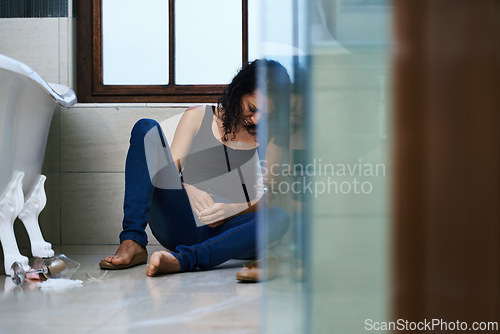 Image of Woman, drug addict and sleep in bathroom for addiction or withdrawal symptoms, depression and mental health. Person or user, overdose and glass of alcoholic for substance abuse for feeling of stress.