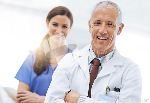 Image of Doctor, nurse and partner in portrait with arms crossed, medical support and wellness at hospital. Medic, mature man and woman in team, happy and healthcare services at clinic with pride for career