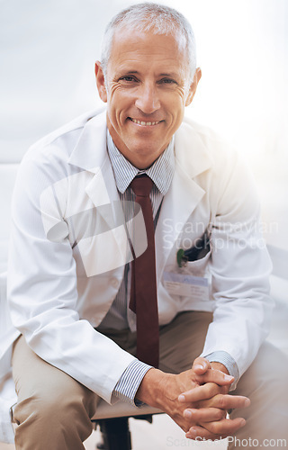 Image of Portrait, senior doctor and happy man in hospital for healthcare, wellness or work in Australia for career. Smile, medical professional or confident surgeon or expert physician in clinic for service