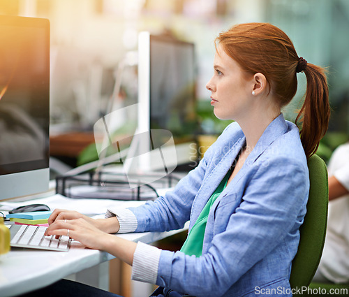 Image of Business, woman and computer with typing, internet and journalist with PR agency and online reading for a company blog. Person, consultant or publisher with pc or magazine editor for research or tech