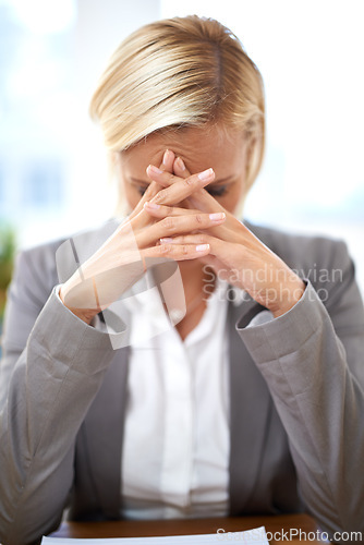 Image of Lawyer, woman and stress with headache in office with hands, worry and tired of case investigation. Advocate, attorney and person with burnout, frustrated and fatigue with legal paperwork at law firm