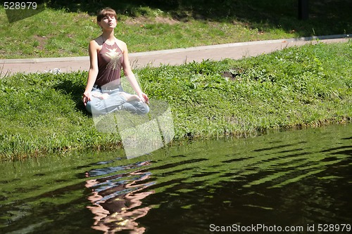 Image of meditation near by water