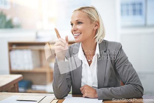 Image of Woman, smile and point with ideas at office desk in career at law firm for justice, crime or investigation. Lawyer, advocate or attorney with thinking, vision and happy for decision, evidence or case