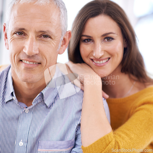 Image of Couple, portrait and happy in home for love with support, trust and embrace in living room of house. Senior man, woman and smile with face for hugging, affection and healthy relationship in apartment
