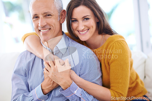 Image of Happy, couple and hug in portrait, love with unique relationship and support for trust at home. Aged man, young woman and age difference in marriage, commitment and loyalty with pride together