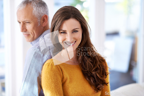 Image of Couple, portrait and smile in home for love with support, trust and comfort in living room of house. Mature man, woman and happy with face for marriage, affection or healthy relationship in apartment