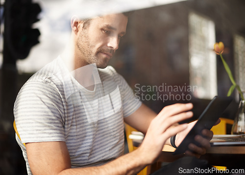 Image of Man, tablet and coffee shop for networking, online communication and website for information. Male person, cafe and app for conversation, social media and remote work in restaurant for research