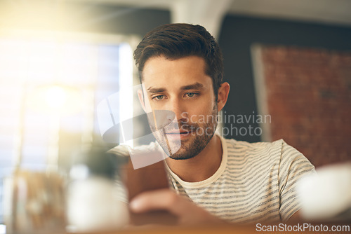 Image of Man, relax at cafe with smartphone and scroll online for social media, tech and communication. Chat, reading on mobile app or ebook with break at coffee shop, contact and using phone with network