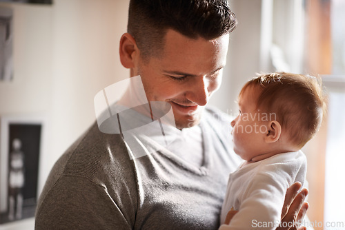 Image of Father, baby and home with love, youth and support together with family care and development. Dad, smile and young child in a house with parent bonding with newborn and happy about infant growth