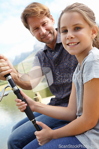 Image of Father, kid and fishing in nature for teaching, learning and outdoor with holiday, travel or sustainable living in portrait. Happy family, dad or fisherman with girl by water or lake for adventure