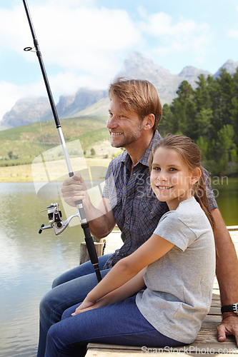 Image of Father, child and fishing in nature for teaching, learning and outdoor with holiday, travel or sustainable living in portrait. Happy family, dad or fisherman with girl by water or lake for adventure