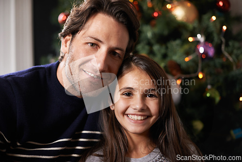 Image of Christmas, family and portrait of father with girl in home for celebration, festival and season event. Face of happy dad and child bonding, relax and embrace for holiday, vacation and festive party