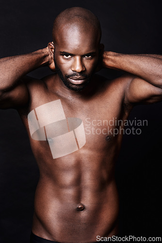 Image of Black man, shirtless and body with abs in portrait, fitness and health with muscle on dark background. Exercise, sport and athlete with six pack, confident and masculine with testosterone in studio