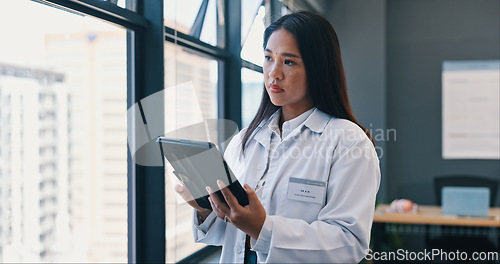 Image of Healthcare, doctor and tablet in hospital with worry for treatment results, telehealth or medical research. Woman, digital technology and concern for information, bad diagnosis or online consultation