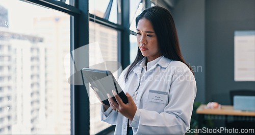 Image of Healthcare, doctor and tablet in hospital with thinking for treatment results, telehealth or medical research. Woman, planning and digital technology for information, diagnosis or online consultation