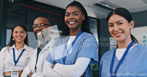Image of Doctors, group and happy with arms crossed in hospital with confidence in medical nurse or mission. Healthcare, team and portrait of people in clinic working in medicare with pride and diversity