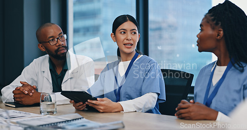 Image of Healthcare, tablet and teamwork in meeting for research, planning and discussion in hospital for collaboration. Medical, nurses and doctor with people for communication, news report or feedback