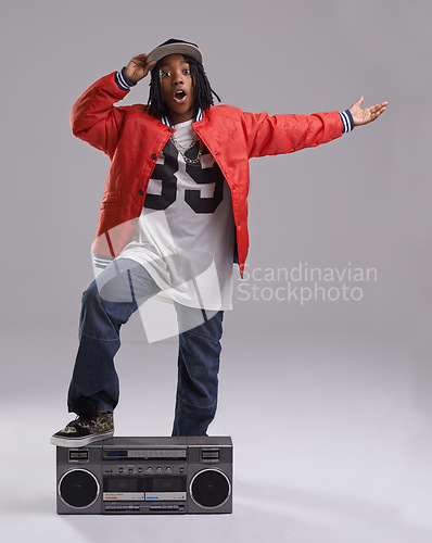 Image of Black child, wow and portrait with radio for hip hop, rap and swag dance with cool clothes in studio. Smile, teen clothing and boombox with urban style and fashion and kid with grey background