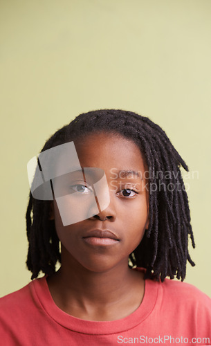 Image of African boy, portrait and fashion in studio with creative, style and confidence on a yellow background. Face of young and cool model, student or teenager in natural hair and casual or trendy t shirt