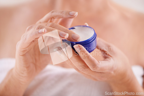 Image of Person, hands or cream for beauty, skincare or cosmetics application for moisturizer, soft or smooth skin. Anti aging, closeup or woman with product, creme or glow for lotion or dermatology in home