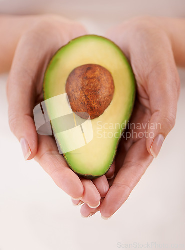 Image of Hands, avocado and vegetable diet for health, antioxidants and minerals or vitamins for wellness. Closeup, person and holding vegan food for green detox, superfoods and omega 3 for organic skincare