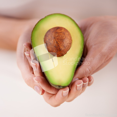Image of Hands, avocado and vegetable diet for nutrition, health and minerals or vitamins for wellness. Closeup, person and holding vegan food for green detox, superfoods and omega 3 for organic skincare