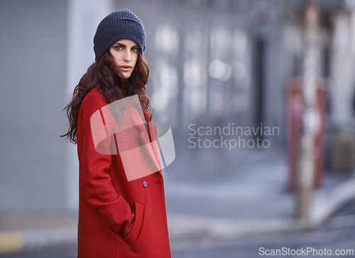 Image of Winter, jacket and woman with fashion in city for travel and walking commute in cool style with red coat. Streetwear, clothes and outdoor on sidewalk with confidence and pride in New York morning