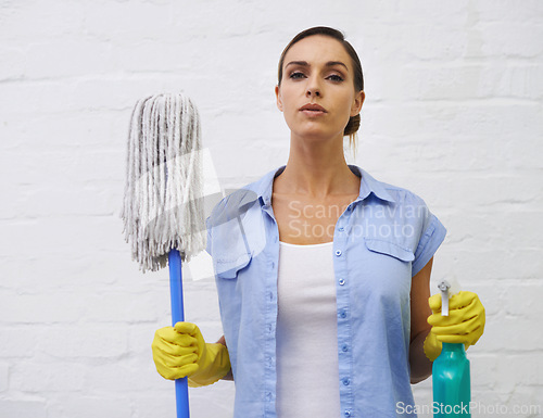 Image of Mop, spray and portrait of woman cleaning in bathroom, home or hotel with confidence. Housework, mission and proud girl, housekeeper or cleaner service washing dirt, germs and sanitation in apartment