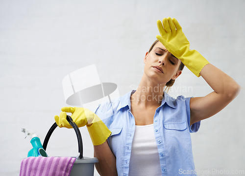 Image of Woman, cleaning and tired for housekeeping in home, bleach and detergent for sanitation or disinfection. Female person, exhausted and maid for sterilization, supplies and rubber gloves for hygiene