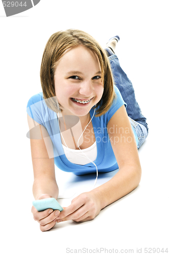 Image of Teenage girl listening to music