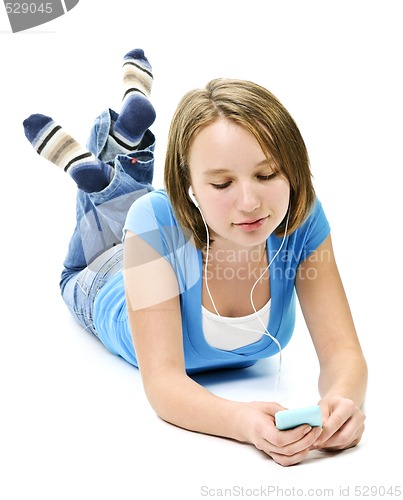 Image of Teenage girl listening to music