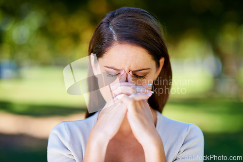 Image of Woman, frown or mental health as stress, anxiety or headache in need of help, support or wellness. Upset, burnout or tired girl as praying for fatigue, brain fog or crisis to end in nature park