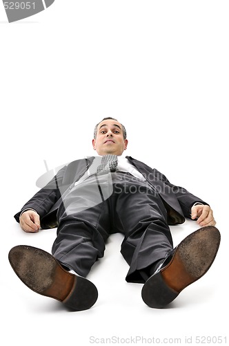 Image of Businessman laying down on white background